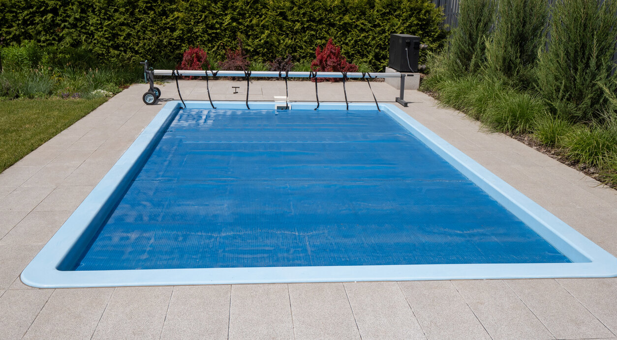 swimming pool with solar pool cover