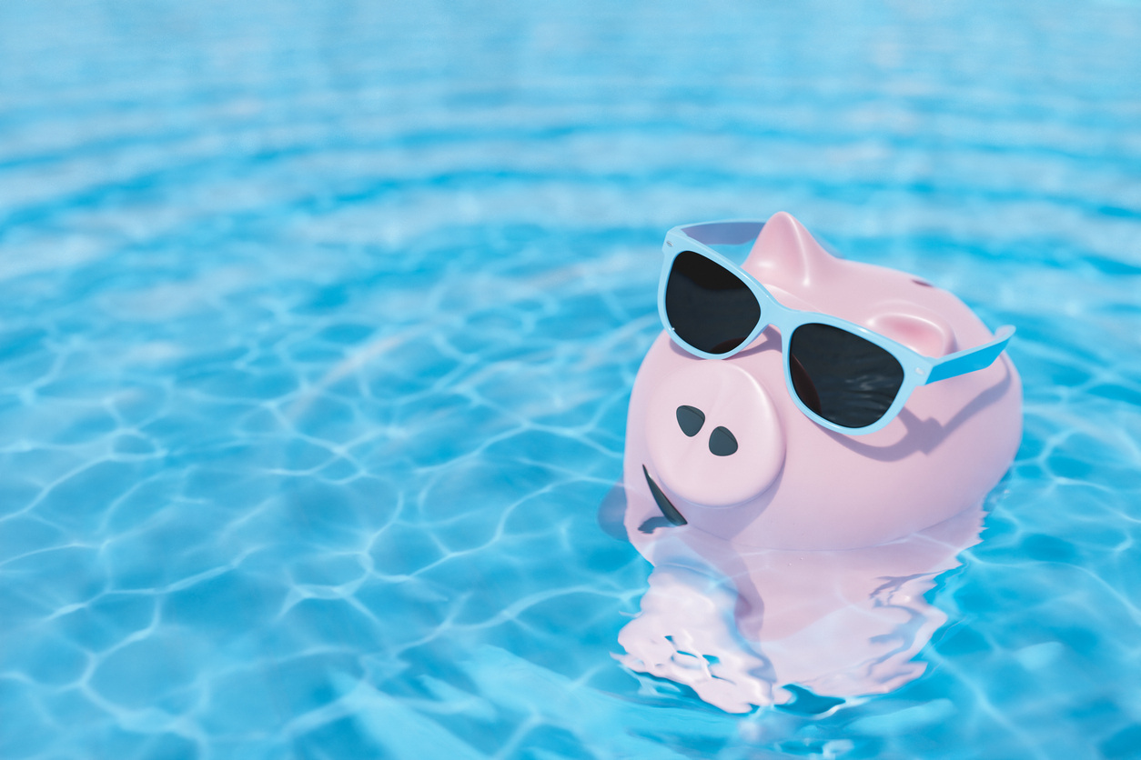 piggy bank wearing sunglasses in pool